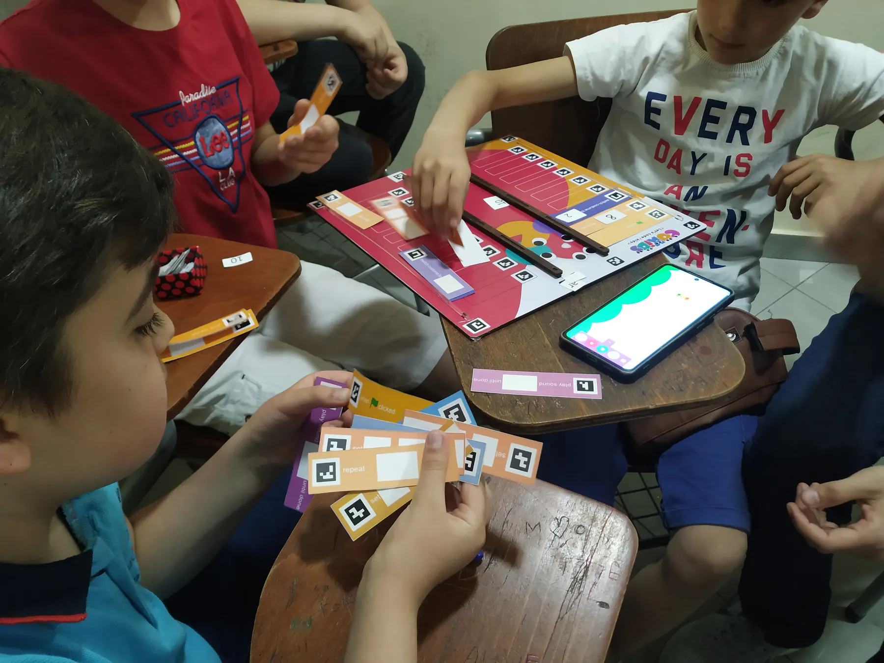 Children learning to code with the CoKids kit