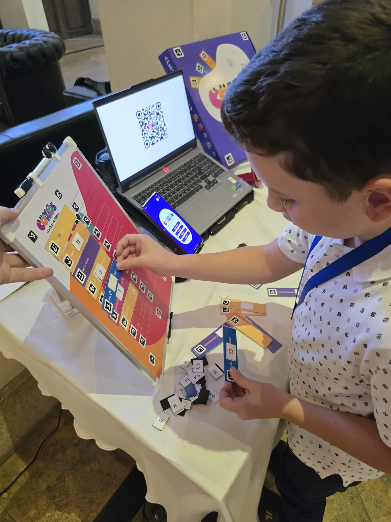 Children learning to code with the CoKids kit