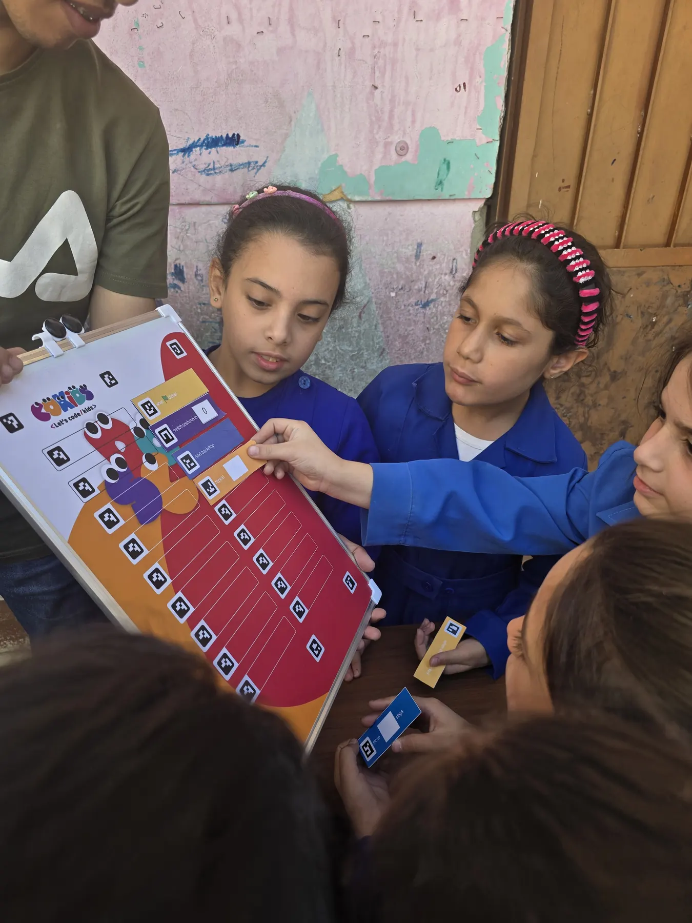 Children learning to code with the CoKids kit