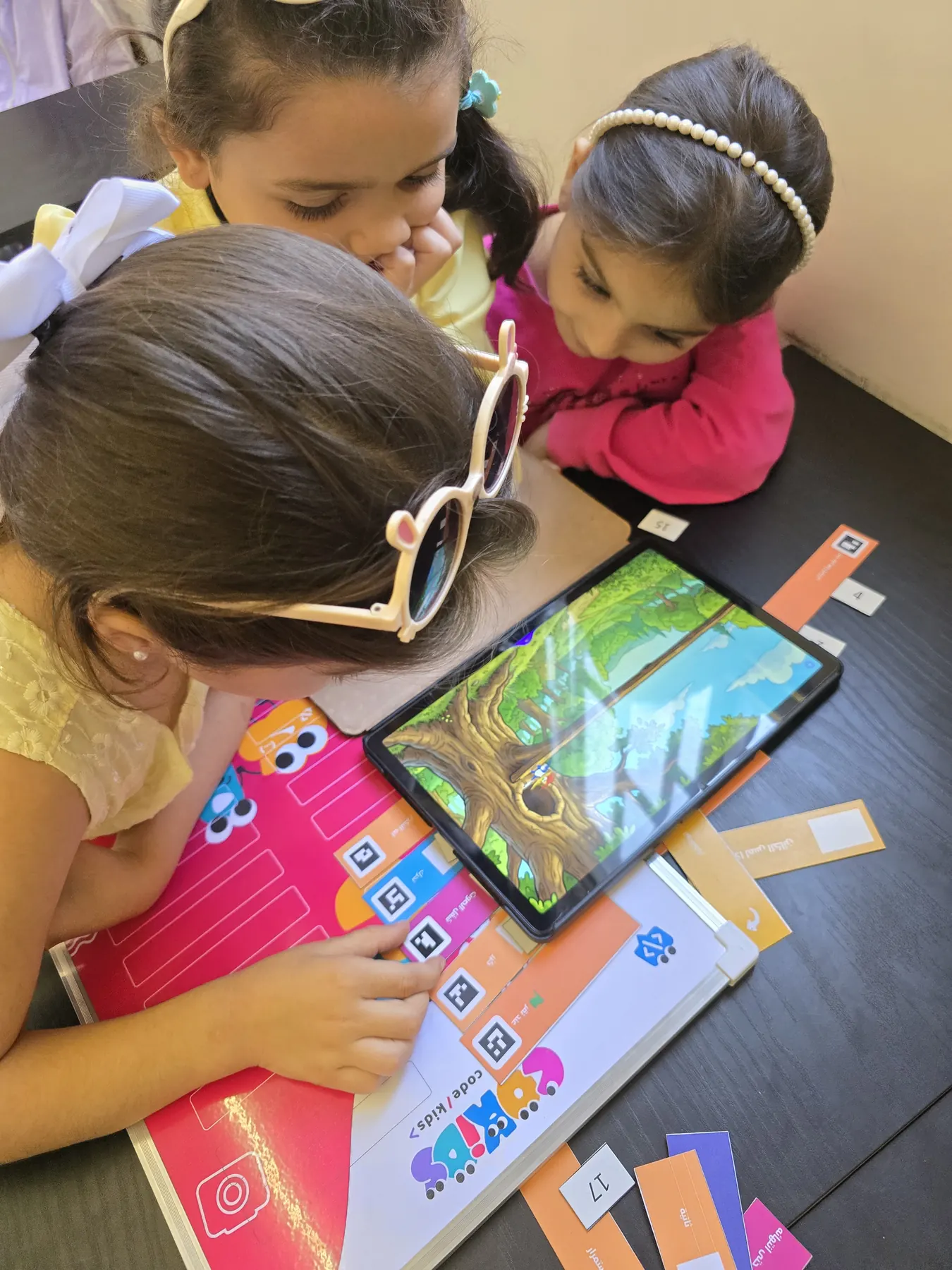 Children learning to code with the CoKids kit