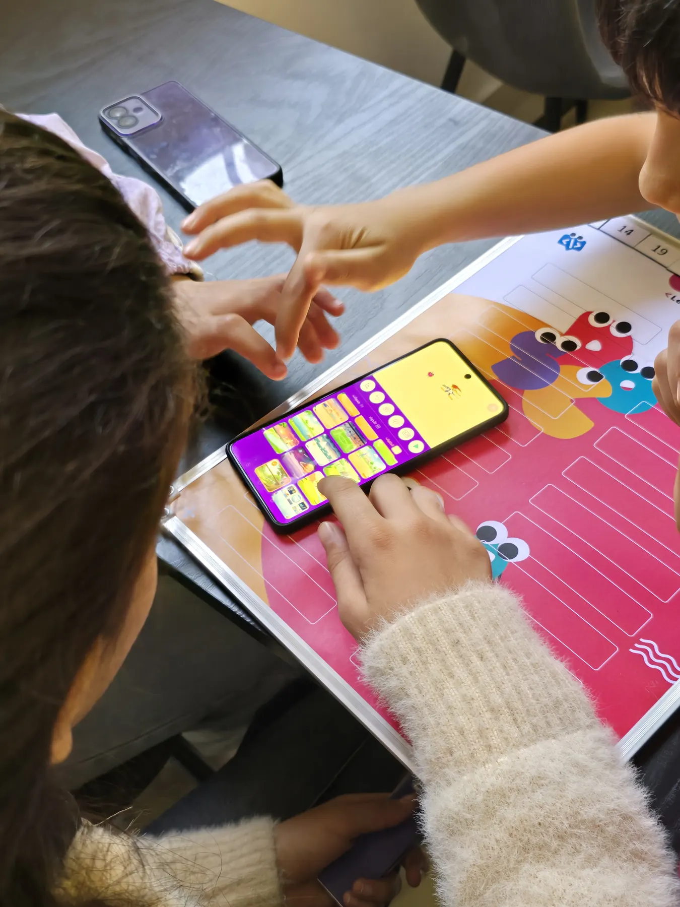 Children learning to code with the CoKids kit