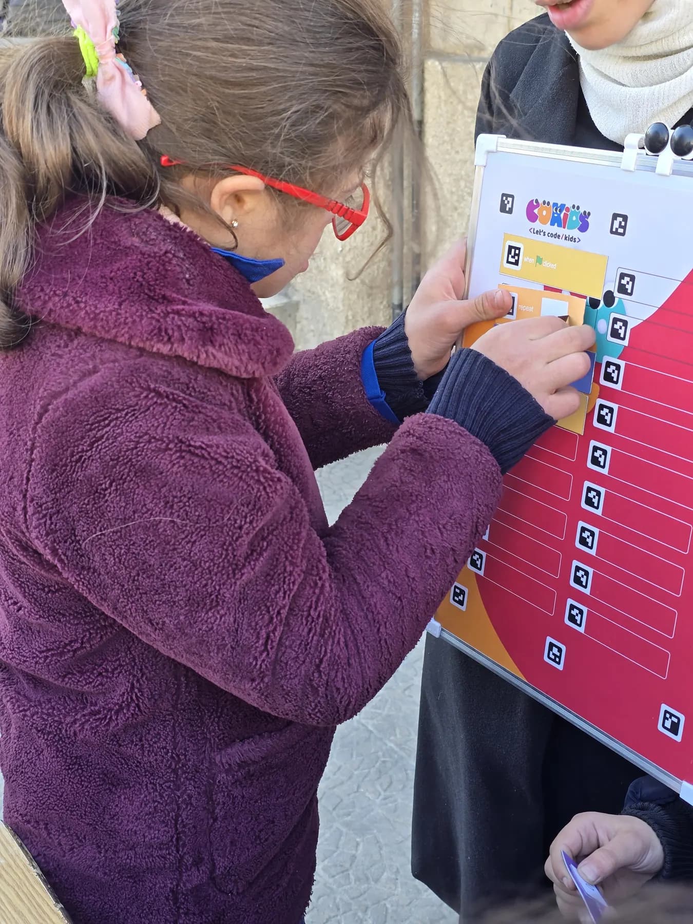 Children learning to code with the CoKids kit