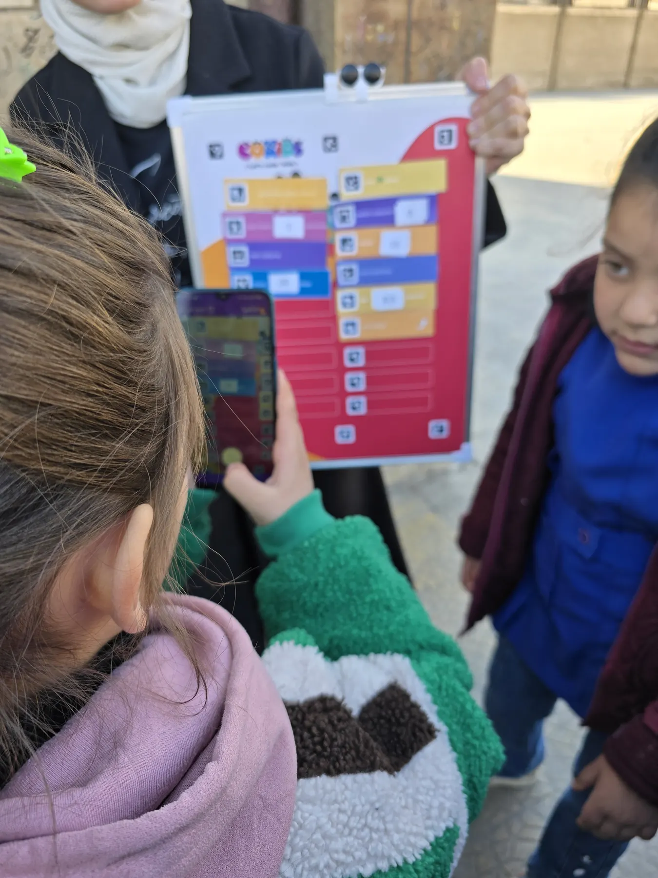 Children learning to code with the CoKids kit