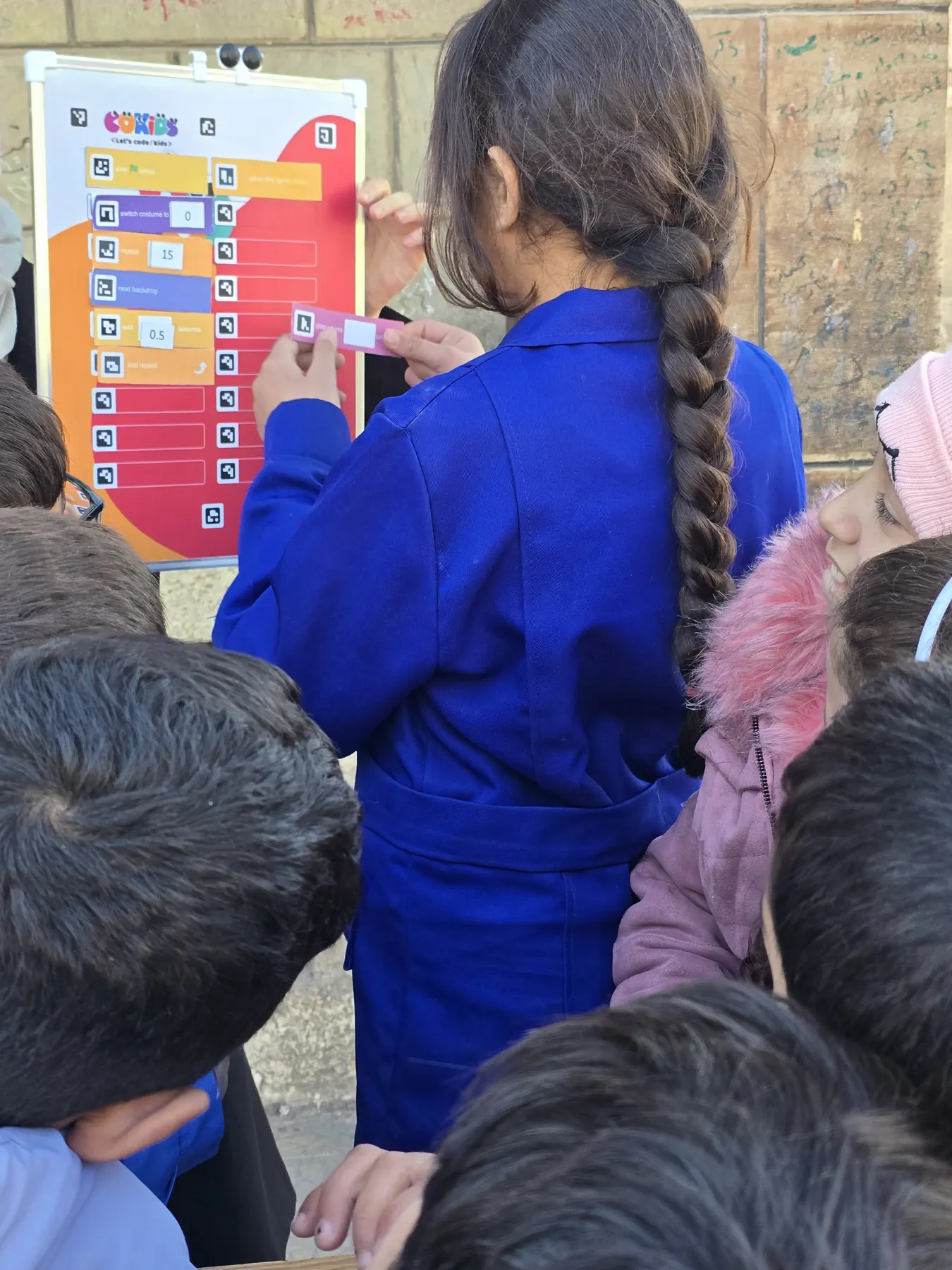 Children learning to code with the CoKids kit