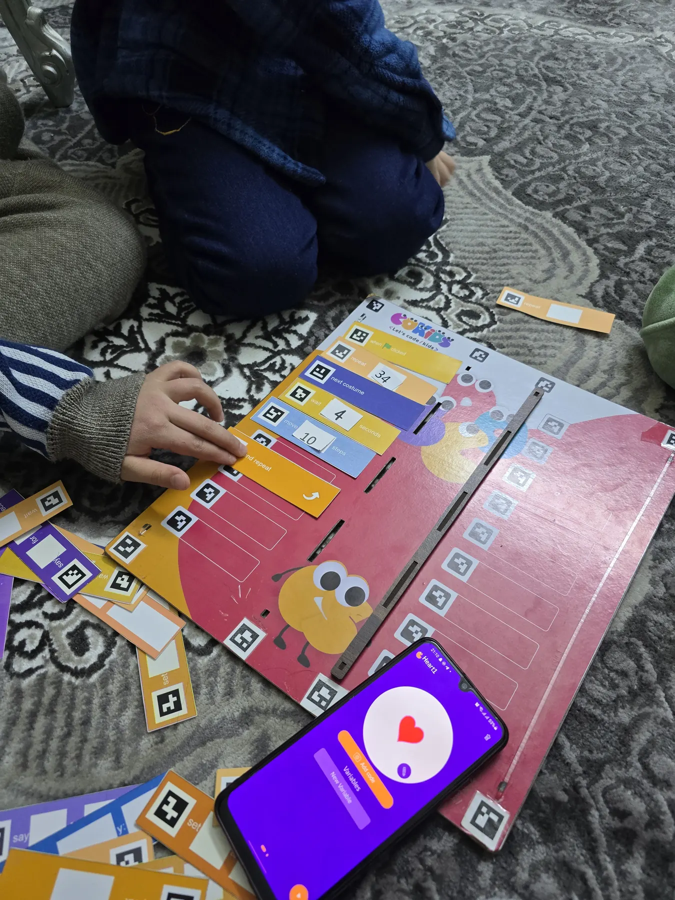 Children learning to code with the CoKids kit