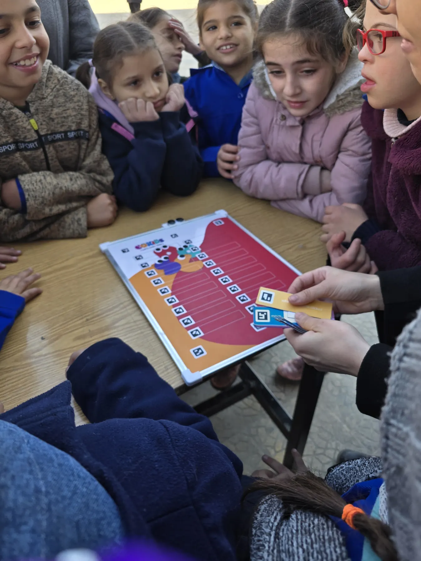 Children learning to code with the CoKids kit