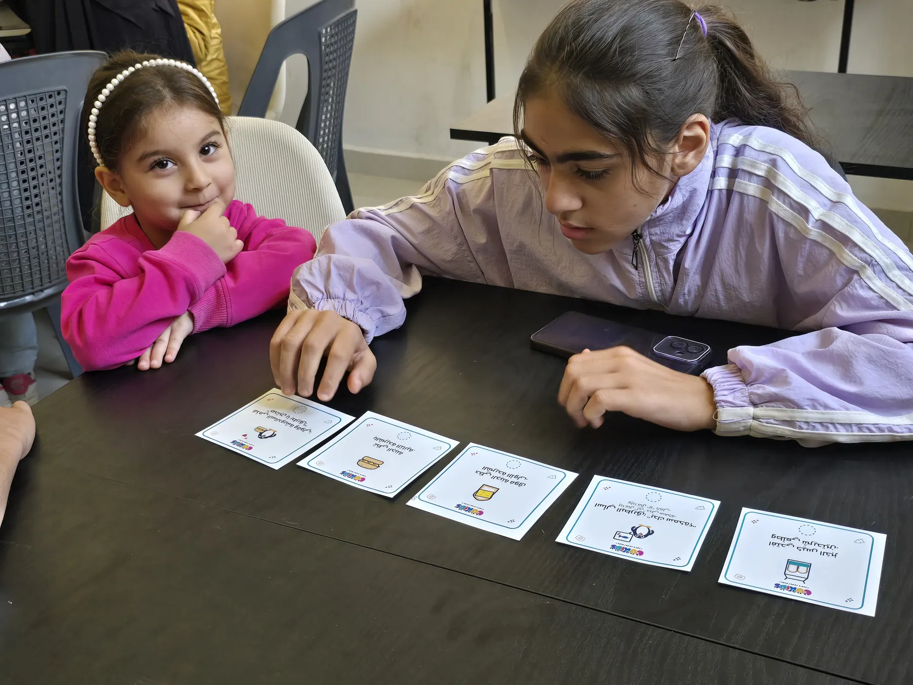 Children learning to code with the CoKids kit