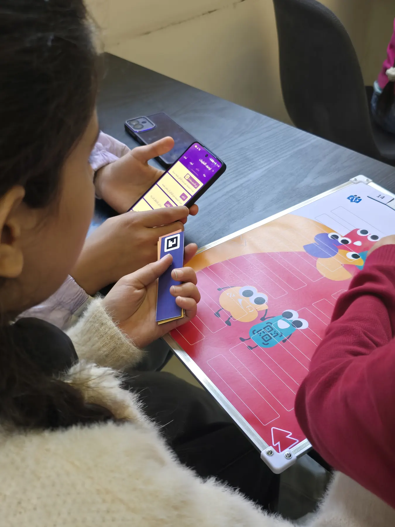 Children learning to code with the CoKids kit