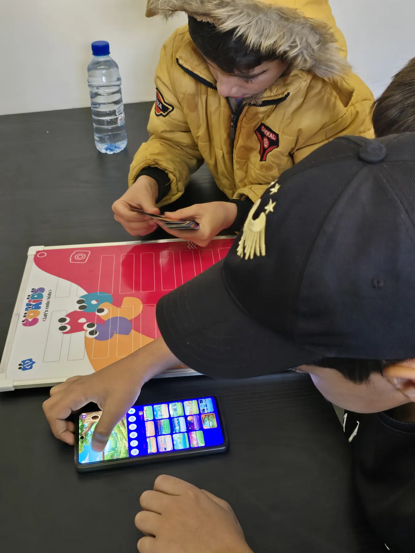 Children learning to code with the CoKids kit