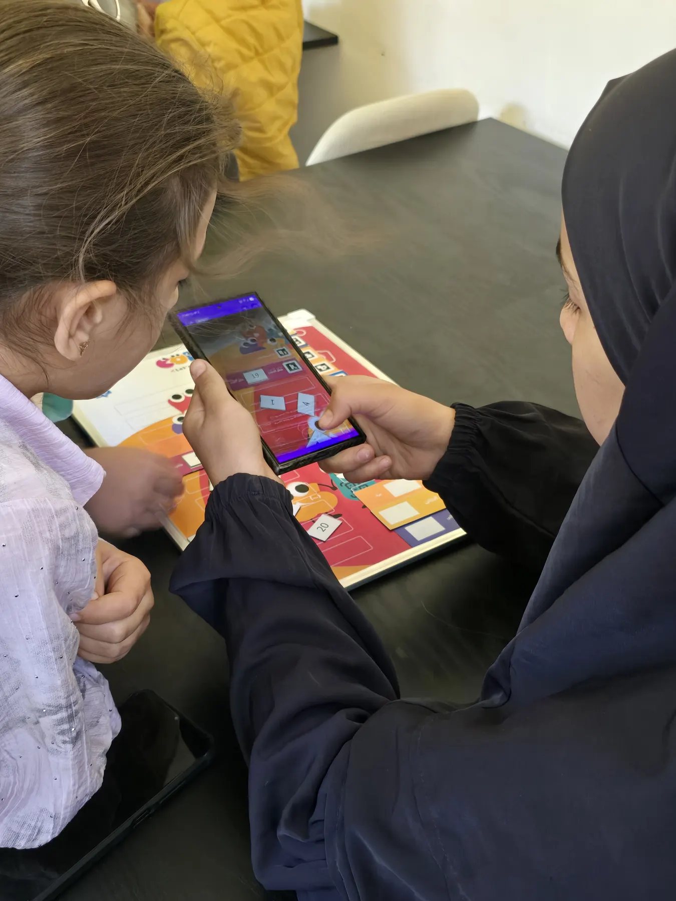 Children learning to code with the CoKids kit