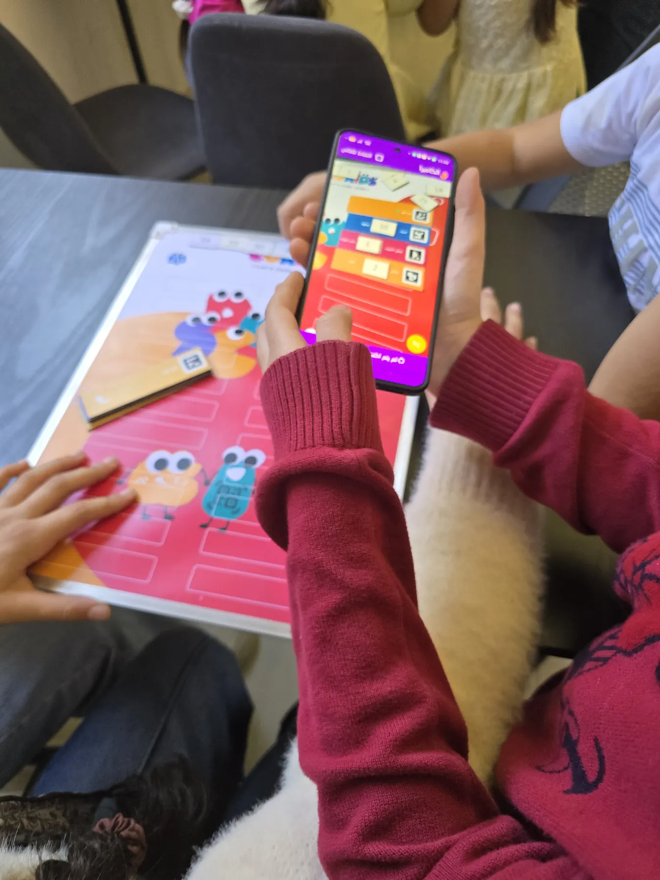 Children learning to code with the CoKids kit