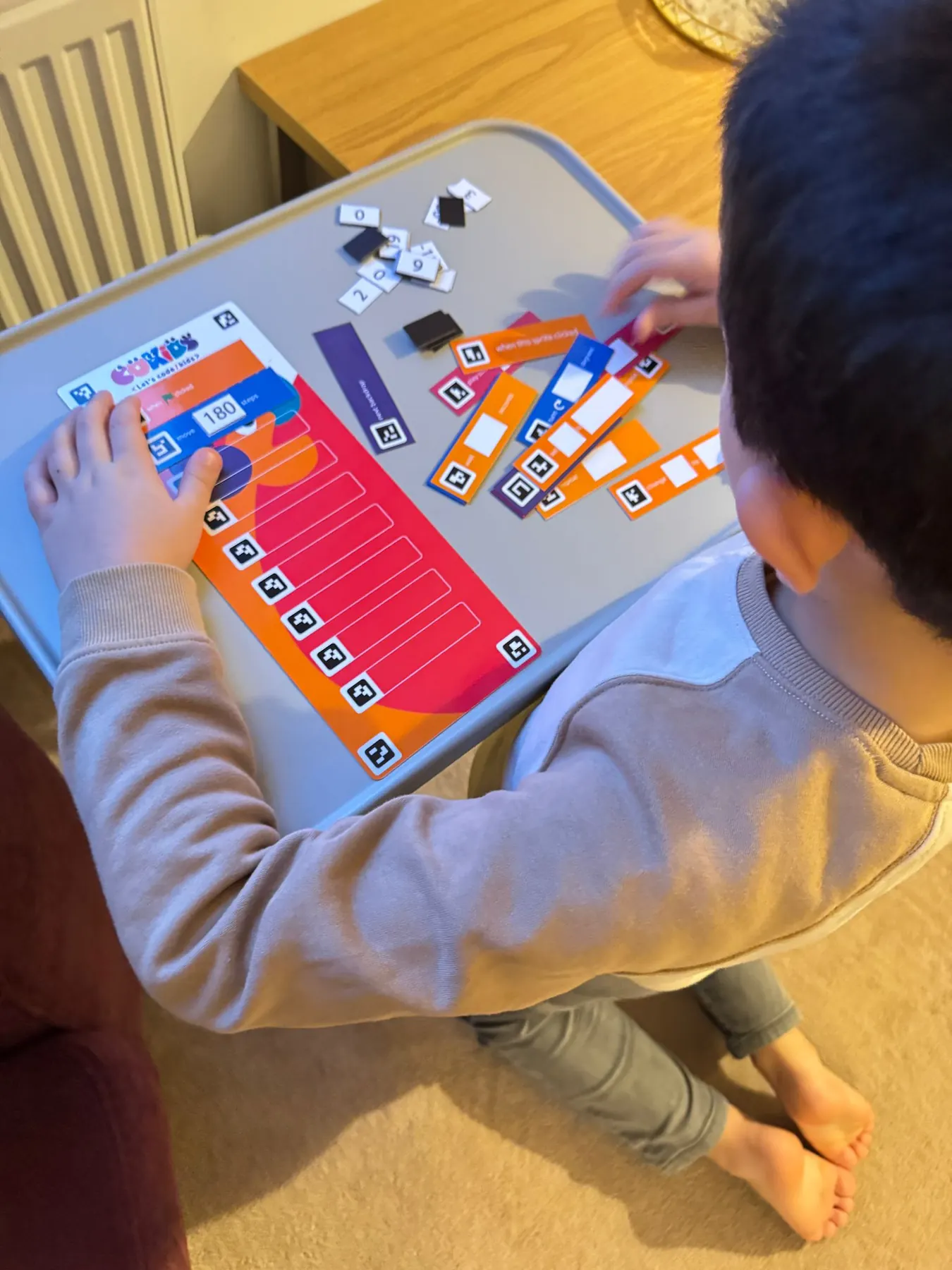 Children learning to code with the CoKids kit