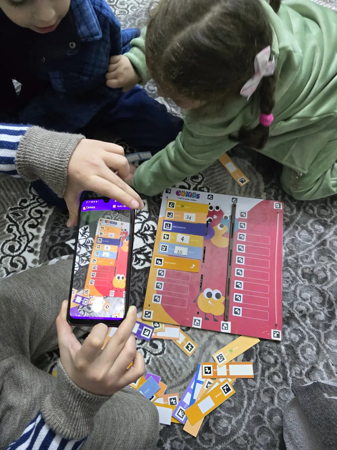 Children learning to code with the CoKids kit