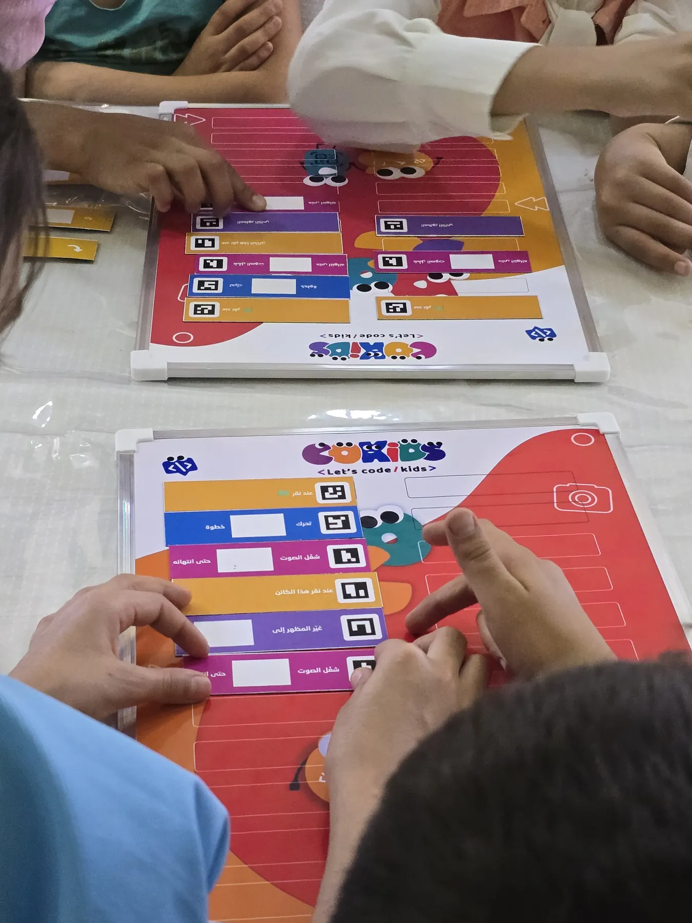 Children learning to code with the CoKids kit
