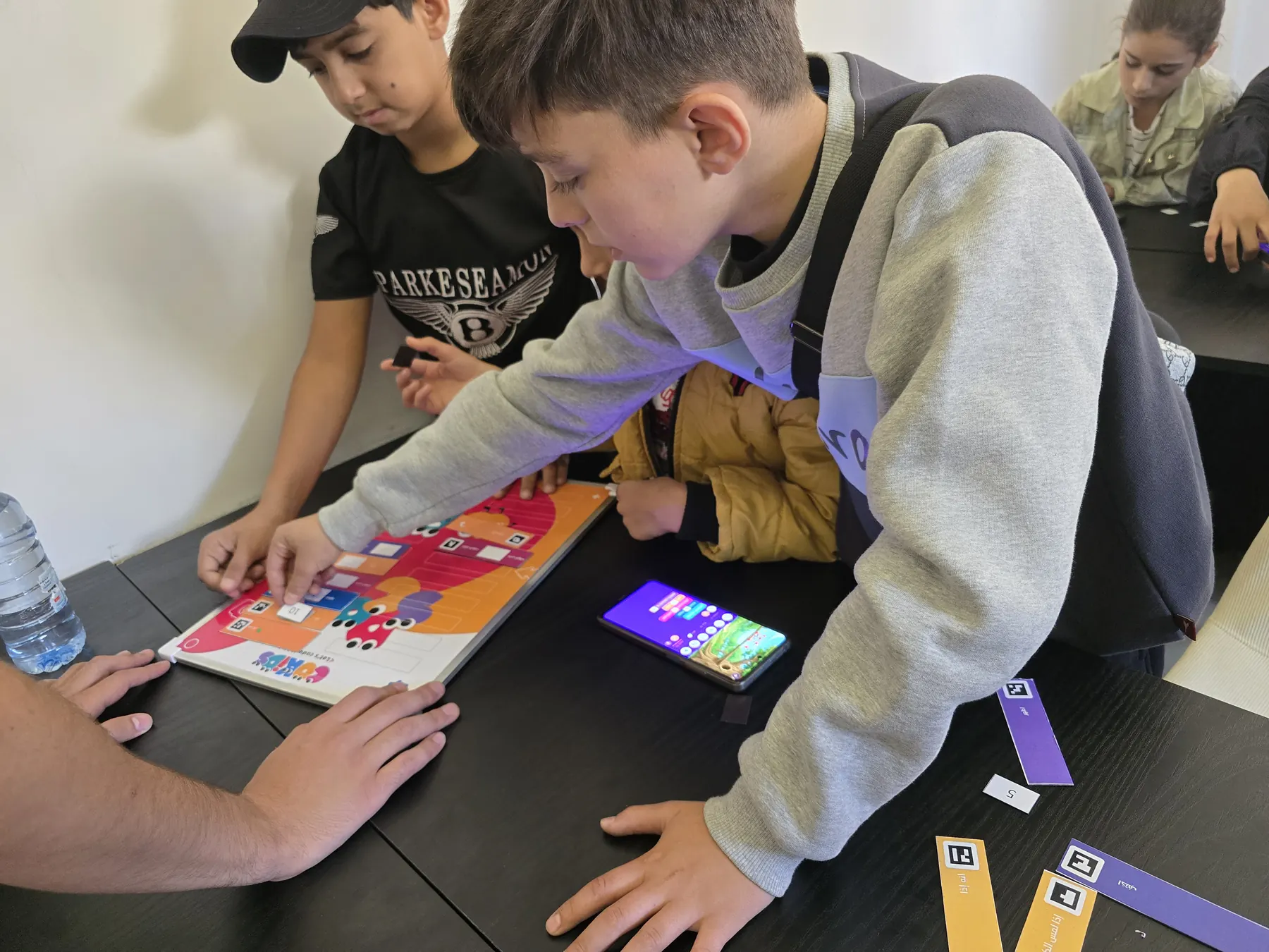 Children learning to code with the CoKids kit